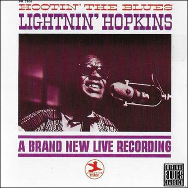 A person singing into a microphone
Description automatically generated