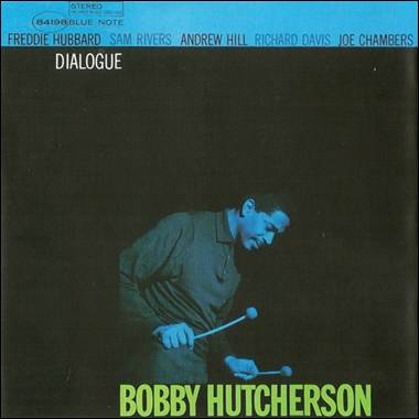 A person holding a microphone

Description automatically generated