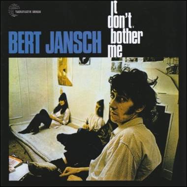 A person sitting on a bed with a person sitting on the bed
Description automatically generated