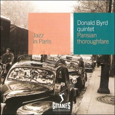 A group of cars on a street
Description automatically generated