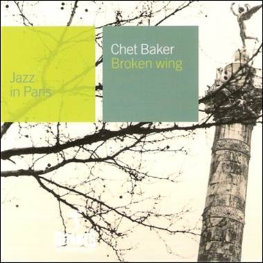 A statue on top of a tree
Description automatically generated