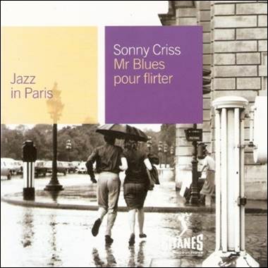 A person and person walking on a wet street
Description automatically generated