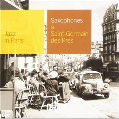 A group of people sitting at tables in a street
Description automatically generated