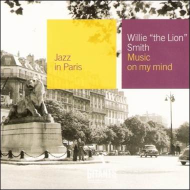 A statue of a lion on a pedestal
Description automatically generated