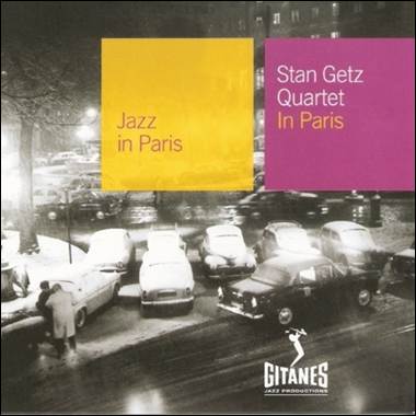 A group of cars parked on a street
Description automatically generated