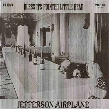 A person lying on a table with bottles on it
Description automatically generated