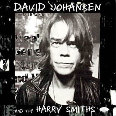 A person with long hair and a black jacket
Description automatically generated