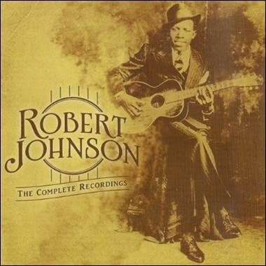 A person holding a guitar
Description automatically generated