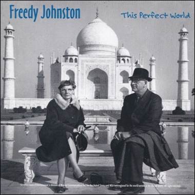 A person and person sitting on a bench in front of a large building
Description automatically generated