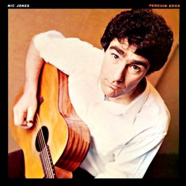 A person holding a guitar
Description automatically generated