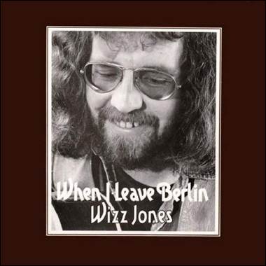 A person with long hair and glasses
Description automatically generated