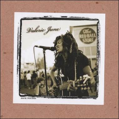 A person singing into a microphone
Description automatically generated