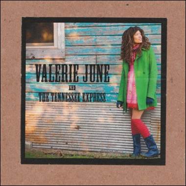 A person in a green coat
Description automatically generated