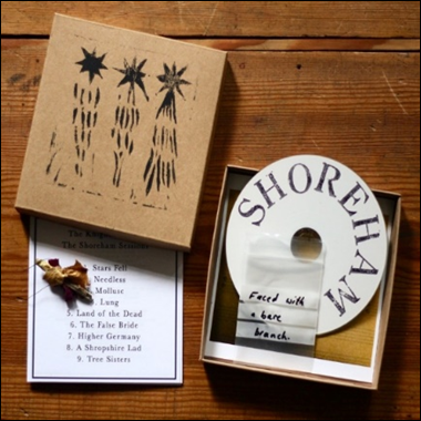 A cd in a box
Description automatically generated