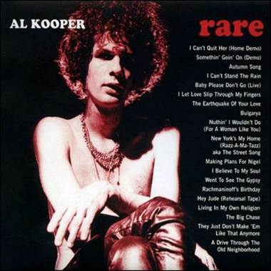 A person with curly hair and red hair sitting on a chair

Description automatically generated