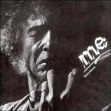 A person holding a microphone
Description automatically generated