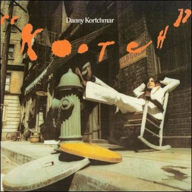 A person sitting in a chair on a sidewalk
Description automatically generated