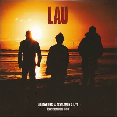 A group of people standing on a beach

Description automatically generated