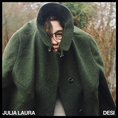 A person in a green coat
Description automatically generated