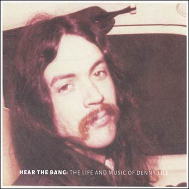 A person with long hair and a mustache
Description automatically generated