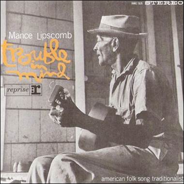 A person holding a guitar
Description automatically generated