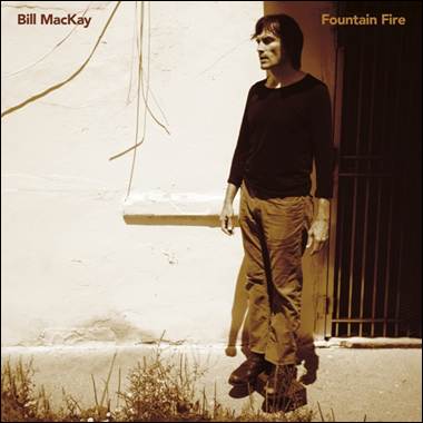 A person standing next to a wall
Description automatically generated