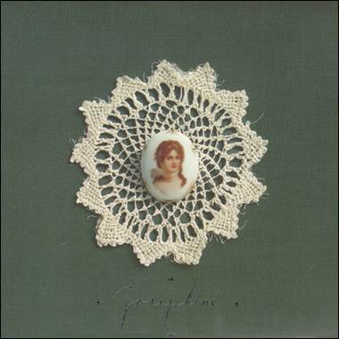 A close-up of a person's face on a lace doily

Description automatically generated