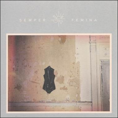 A black dress on a wall

Description automatically generated