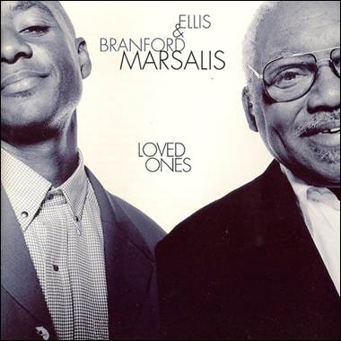 A couple of men posing for a picture
Description automatically generated