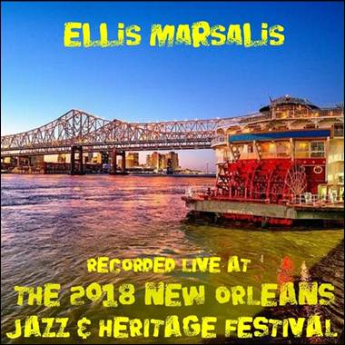 A river with a bridge and a boat
Description automatically generated