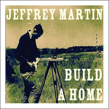 A person standing in a field
Description automatically generated