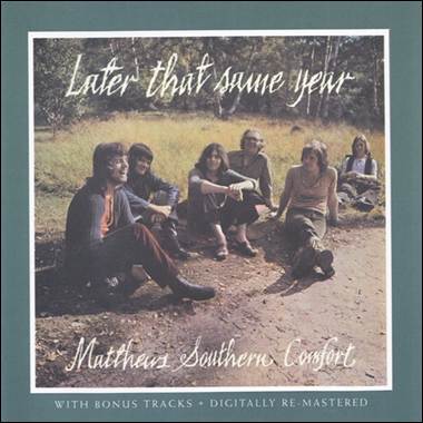 A group of people sitting on a dirt road
Description automatically generated