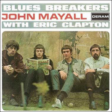 A group of men sitting on a wall
Description automatically generated