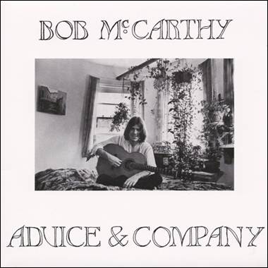 A person holding a guitar
Description automatically generated