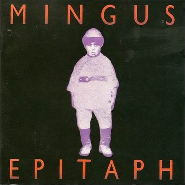 A child standing in front of a black background
Description automatically generated