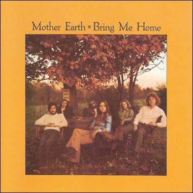 A group of people sitting under a tree
Description automatically generated