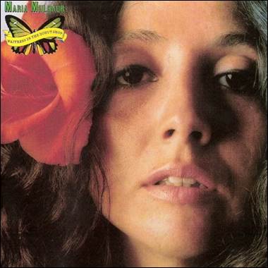 A person with a flower in her hair

Description automatically generated