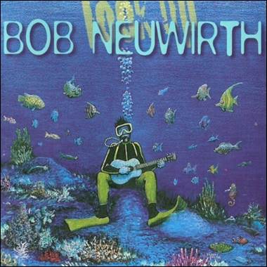 A person in scuba gear playing guitar under water
Description automatically generated