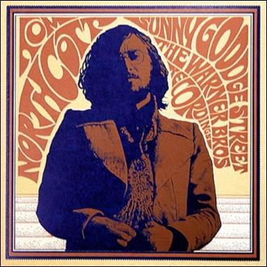 A person with long hair and a beard
Description automatically generated