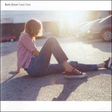 A person sitting on the ground
Description automatically generated