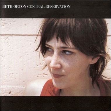 A person with brown hair and bangs
Description automatically generated