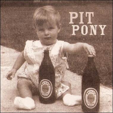 A baby sitting next to two bottles

Description automatically generated