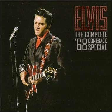 A person playing guitar and singing into a microphone

Description automatically generated