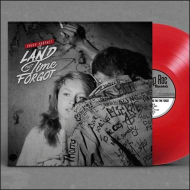A red vinyl record with a cover
AI-generated content may be incorrect.