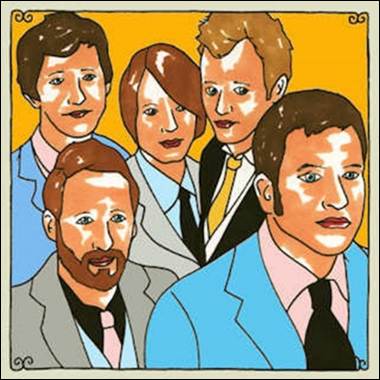 A group of people in suits
Description automatically generated