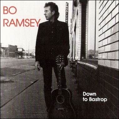 A person holding a guitar
Description automatically generated