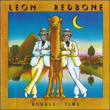 A person standing next to a camel
Description automatically generated