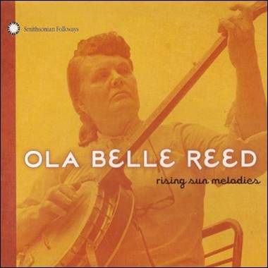 A person playing a banjo
Description automatically generated