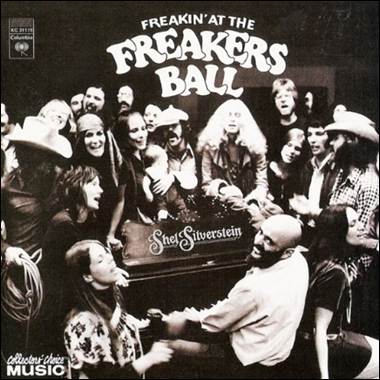 A group of people around a piano
Description automatically generated