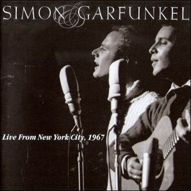 A group of men singing and playing guitar
Description automatically generated